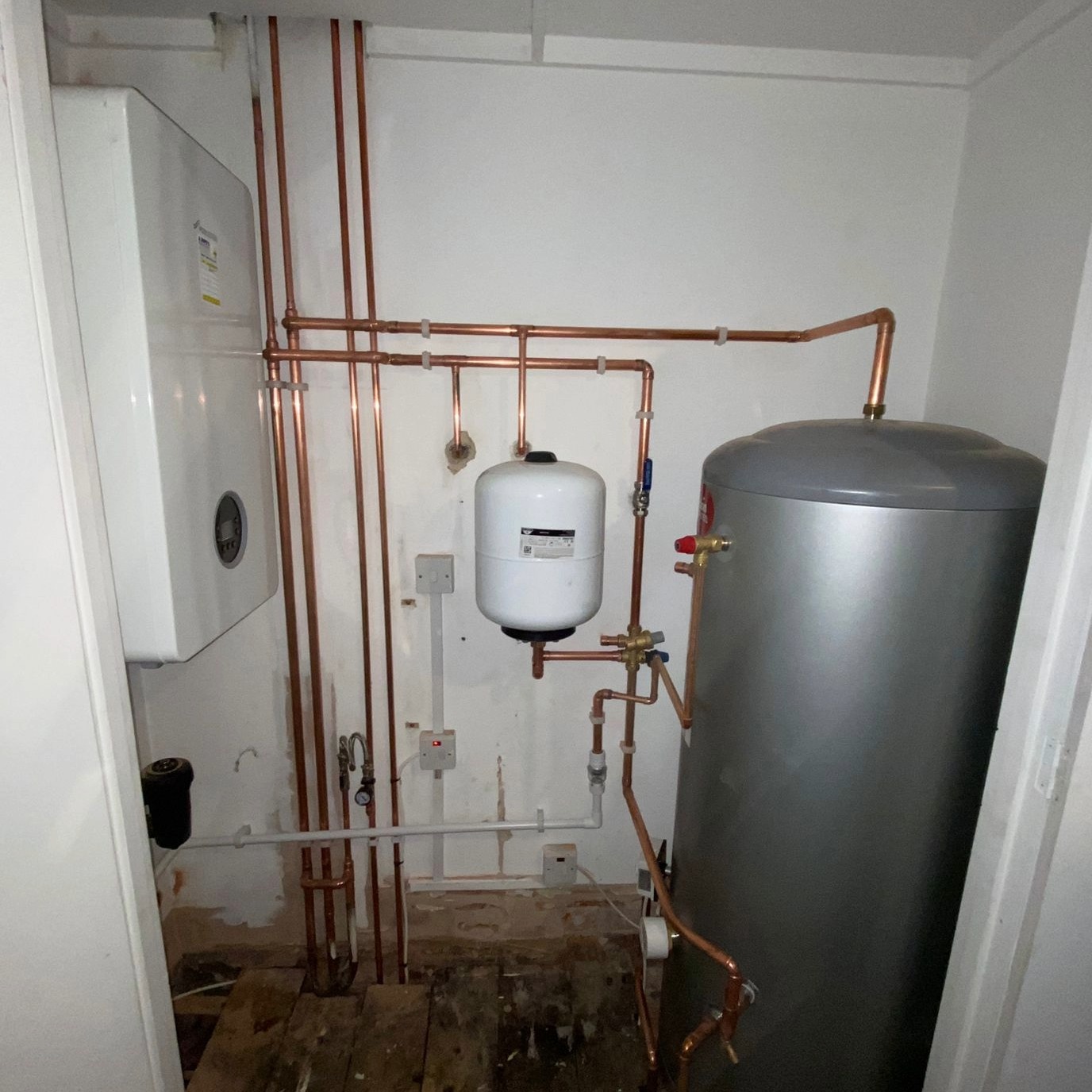 Domestic boiler with copper pipes expertly fitted.